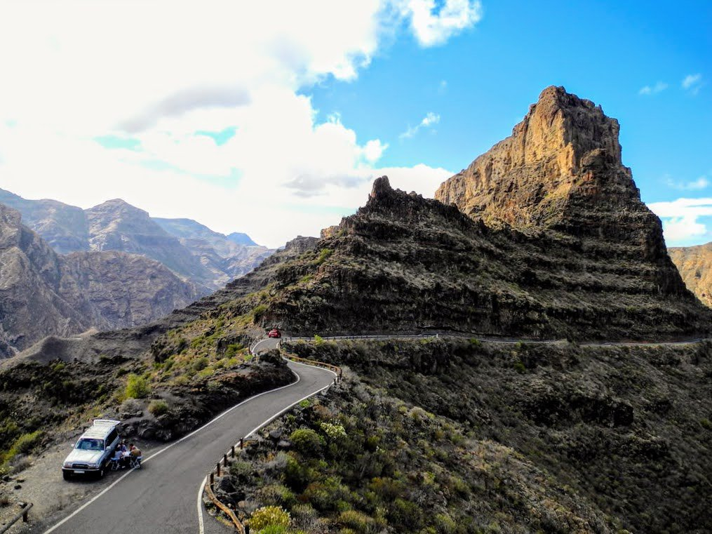 Scenic mountain road with a car driving in the Canary Islands