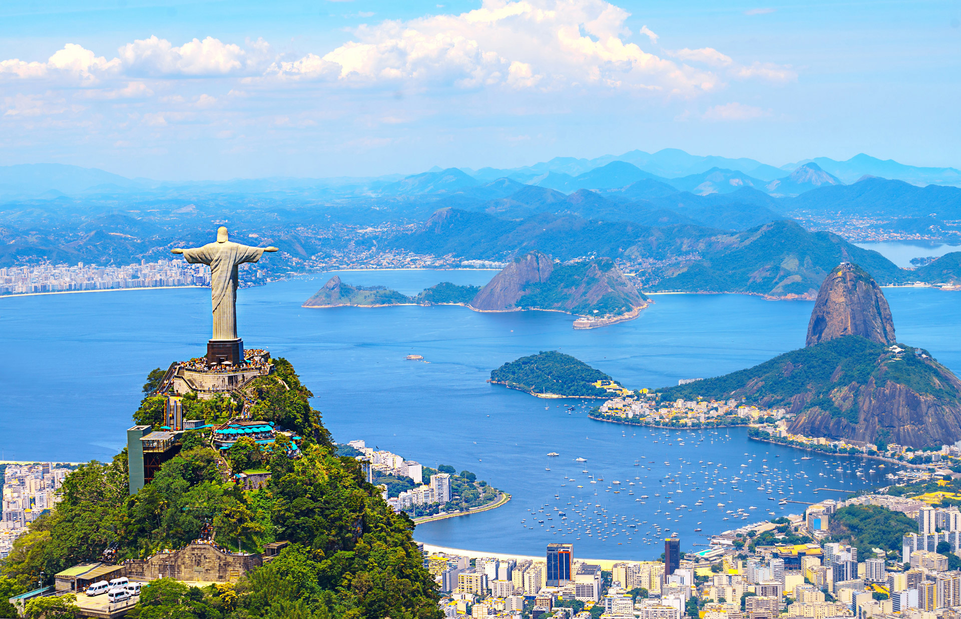 About Rio de Janeiro – Christ the Redeemer, Sugarloaf Mountain and Guanabara Bay Panoramic view of Rio de Janeiro with Christ the Redeemer statue, Sugarloaf Mountain and Guanabara Bay