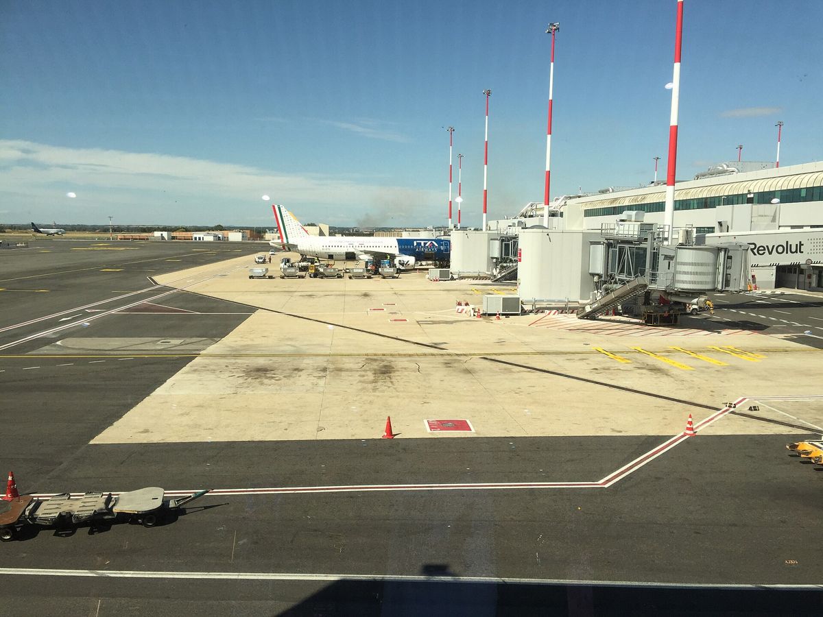 Fiumicino Airport terminal, boarding bridges and aircraft on the apron Fiumicino Airport terminal, boarding bridges and aircraft on the apron