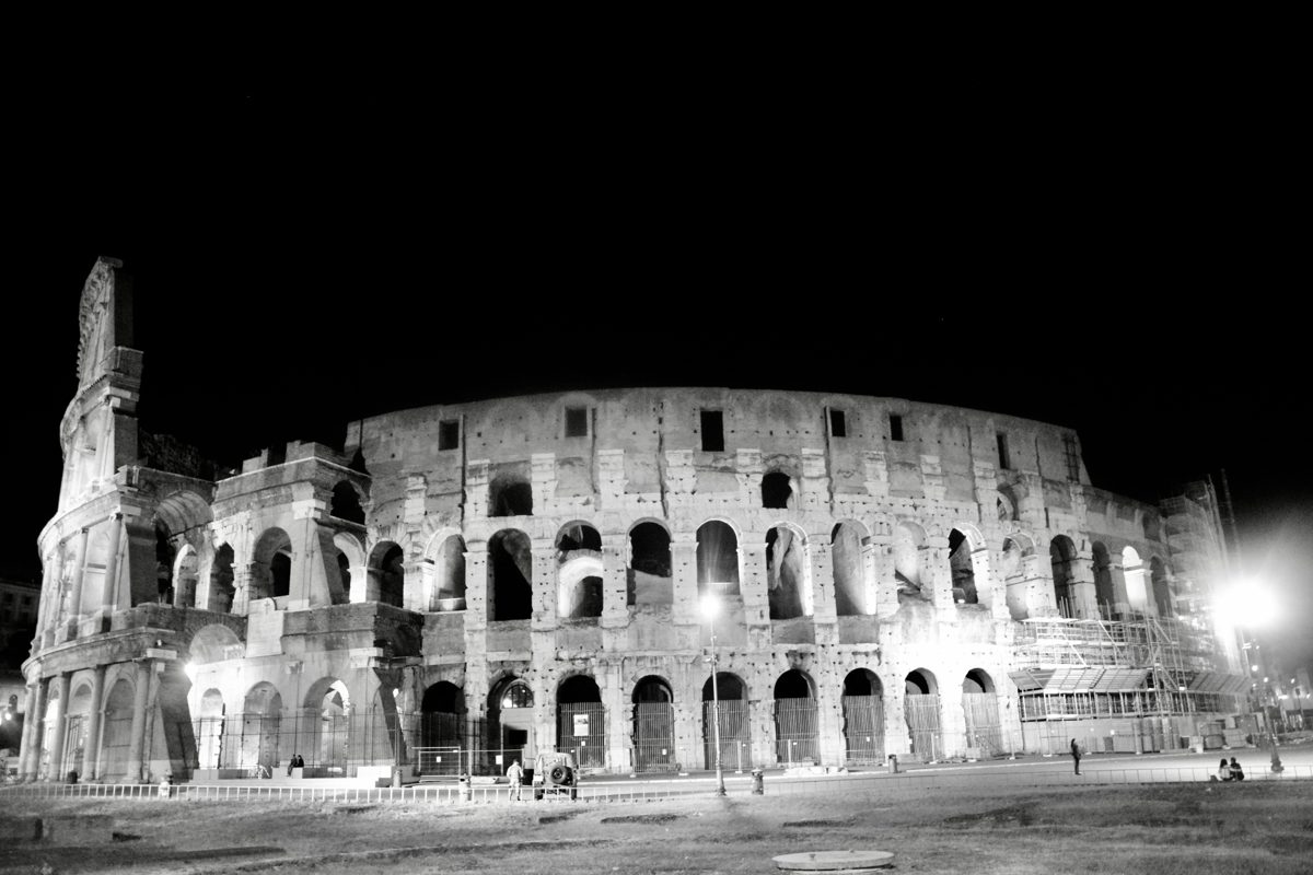 Colosseum exterior illuminated at night in a monochrome photograph
