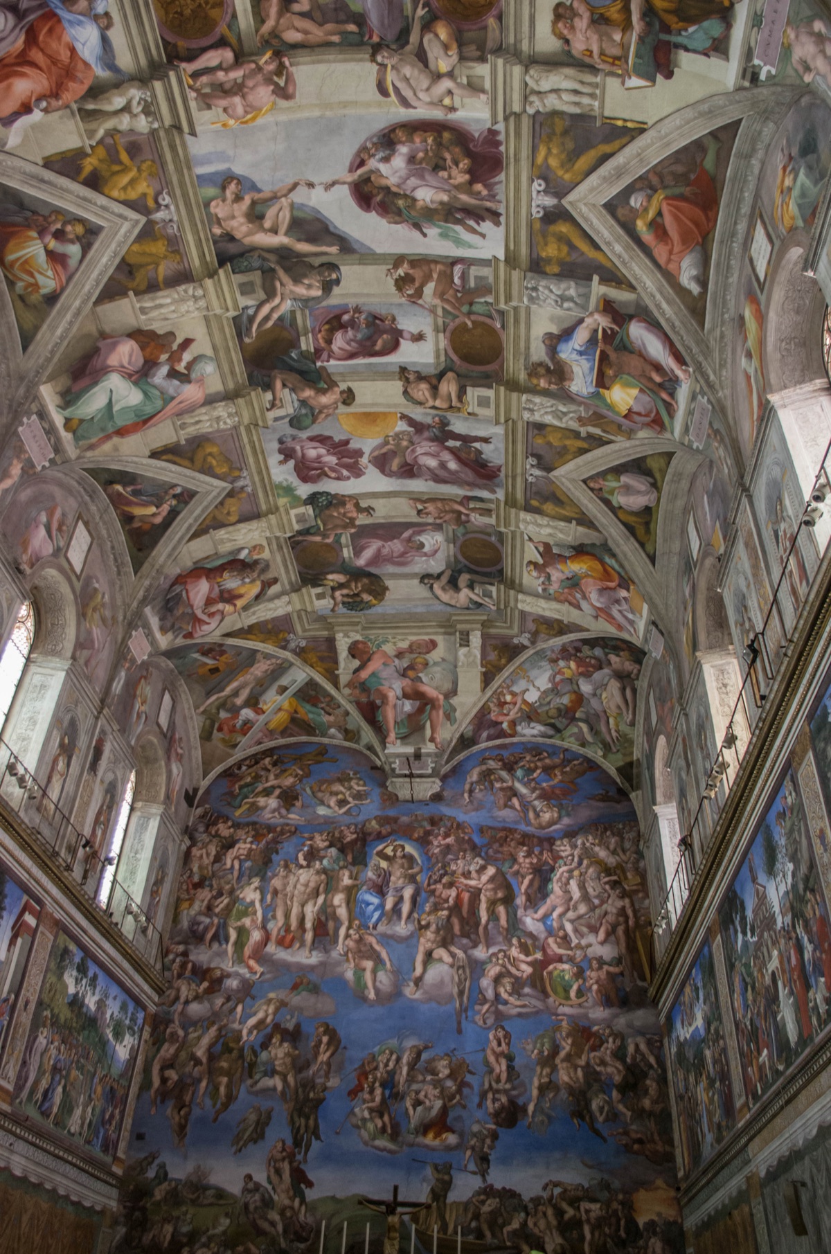 Sistine Chapel interior showing Michelangelo’s ceiling frescoes and The Last Judgement on the altar wall