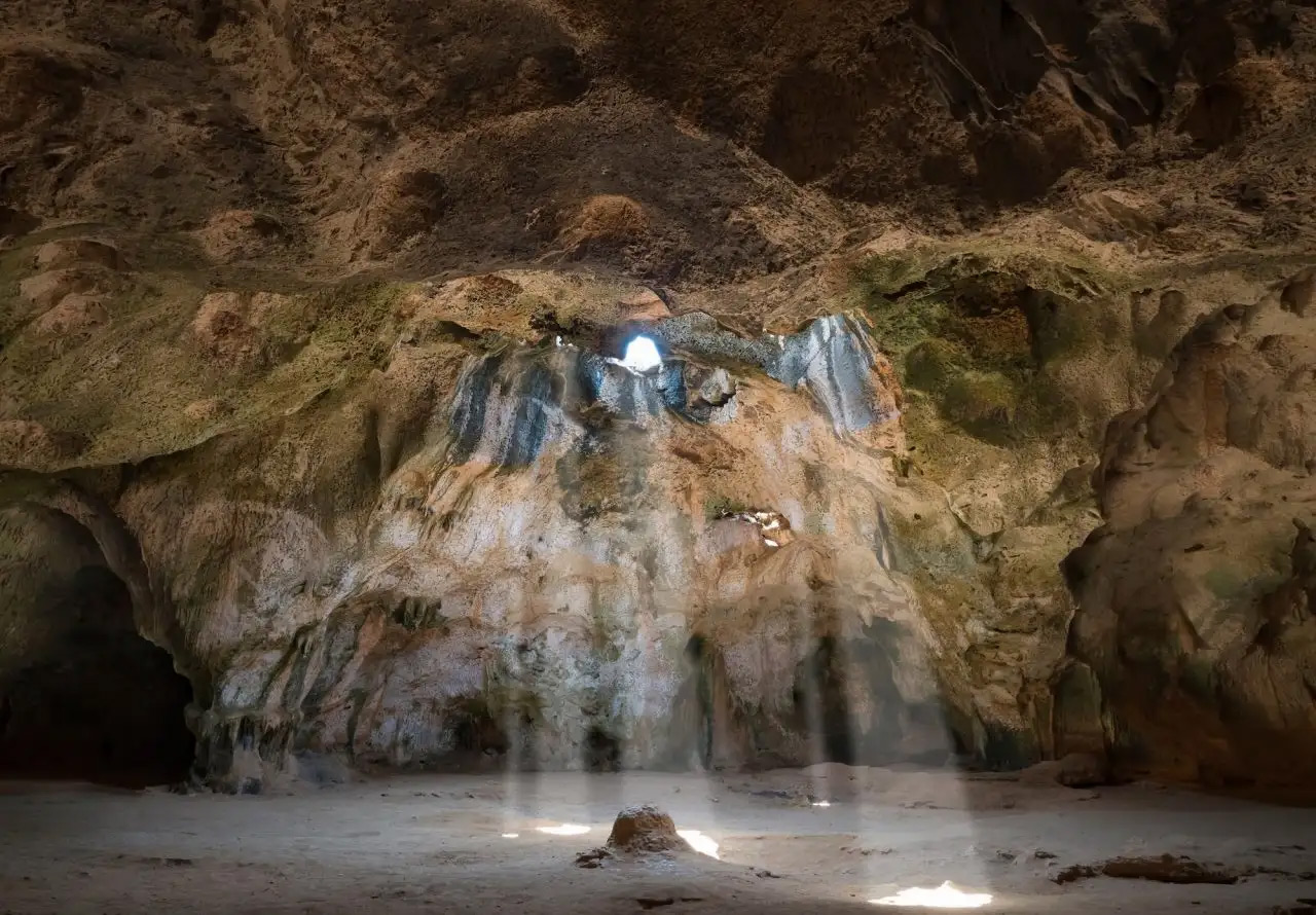 Light beams entering Guadirikiri Cave inside Arikok National Park, Aruba