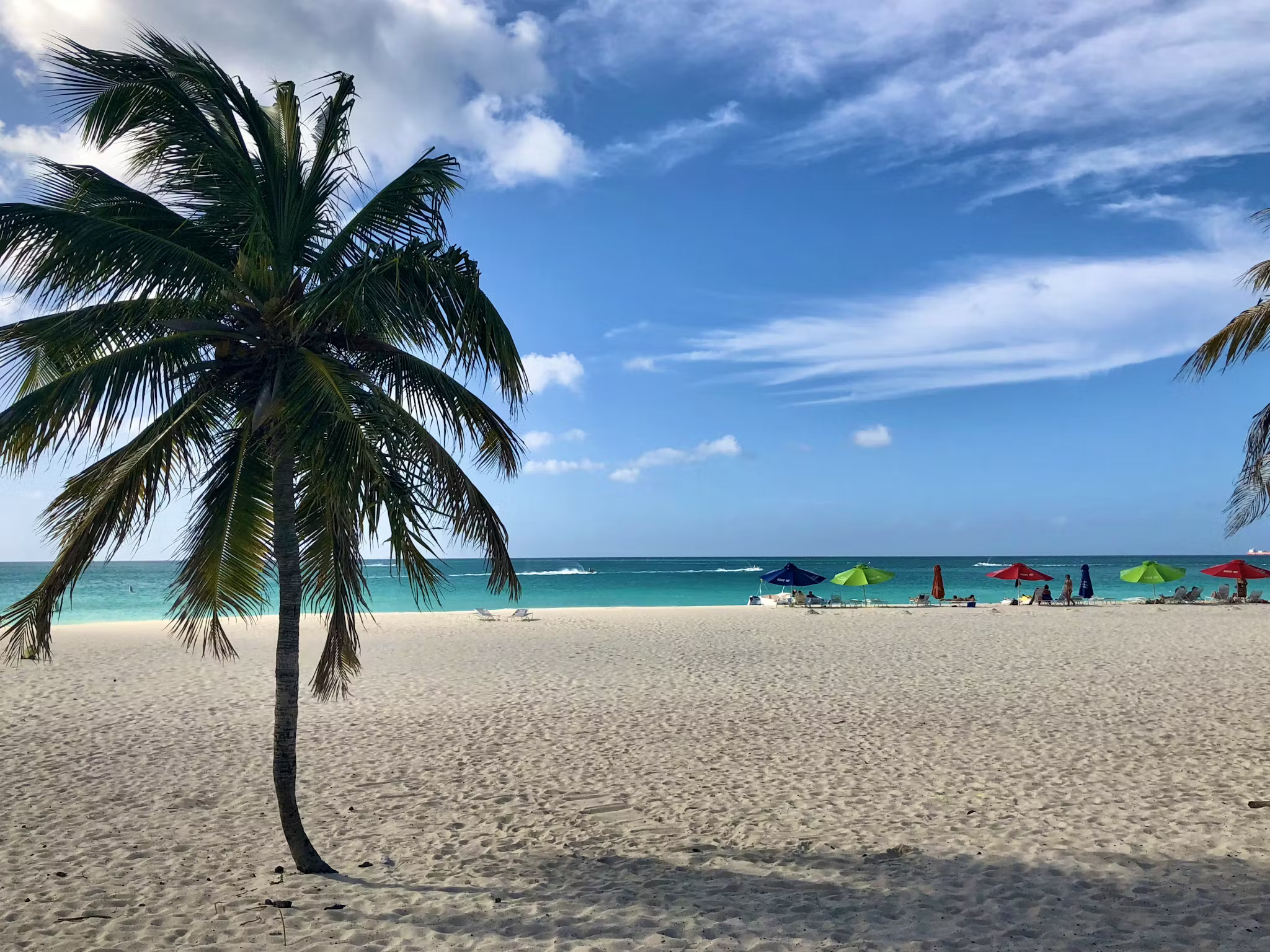 Sunny day on Aruba’s Eagle Beach with turquoise water, clear blue skies and calm Caribbean conditions