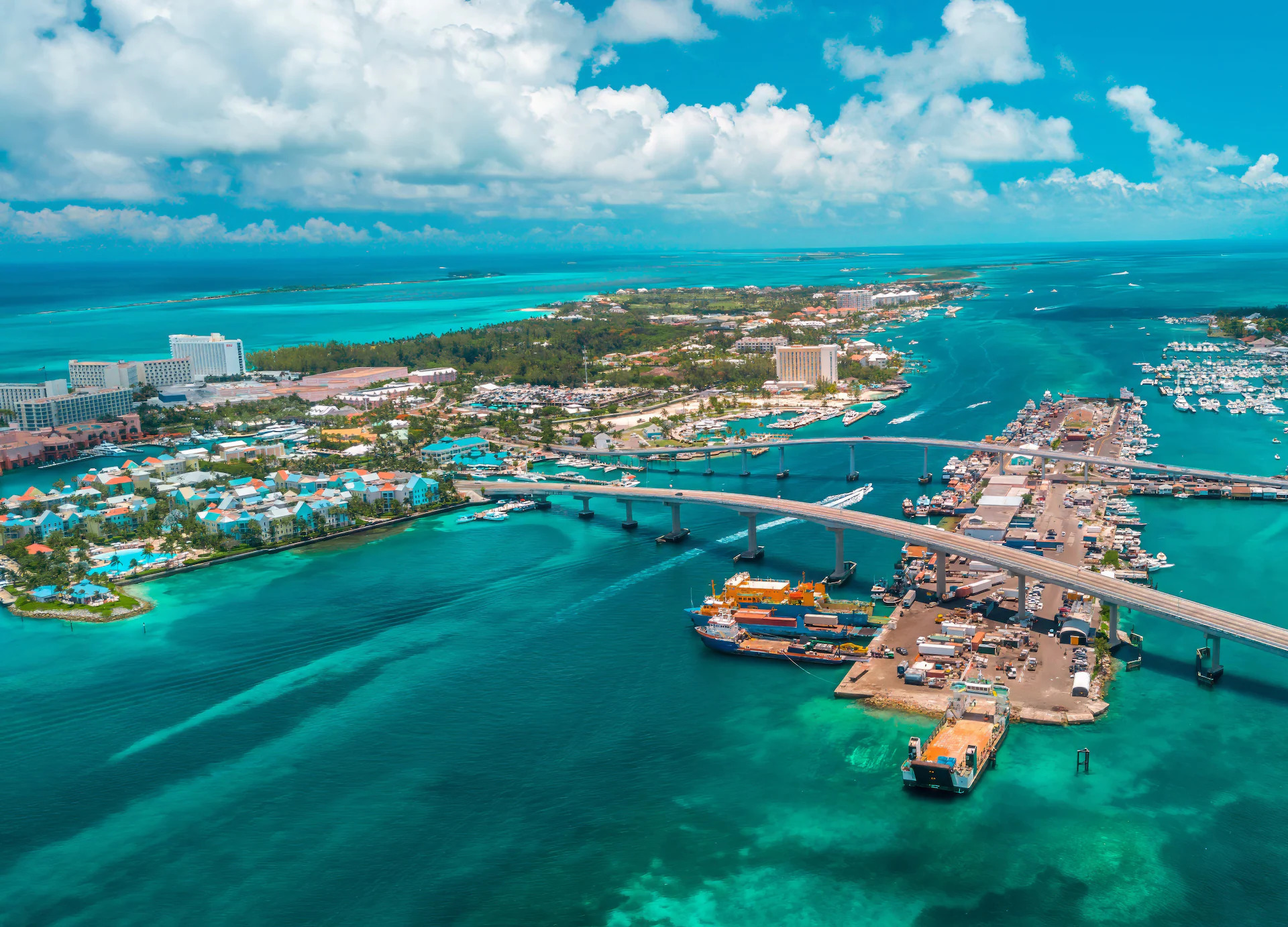 Aerial view of Nassau harbor and Paradise Island in the Bahamas with bridge, resorts and turquoise waters