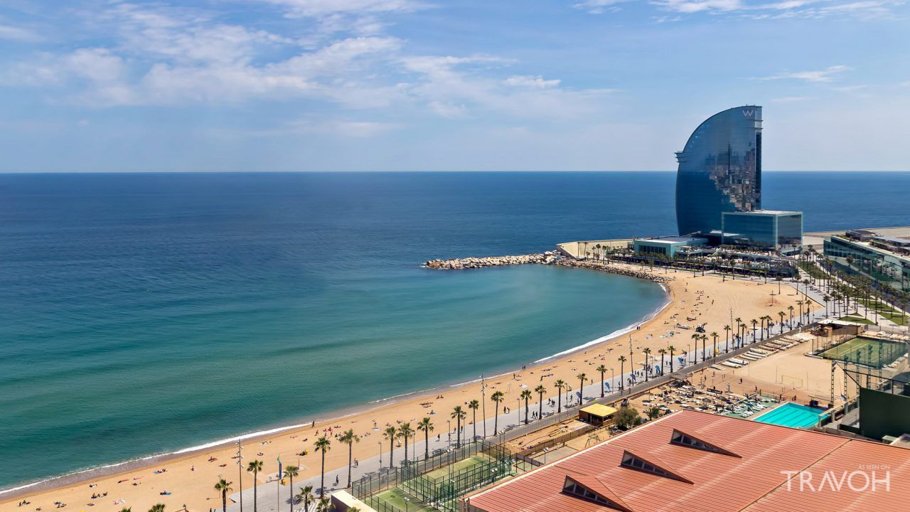 Aerial view of Barceloneta Beach with the iconic W Hotel and Mediterranean coastline