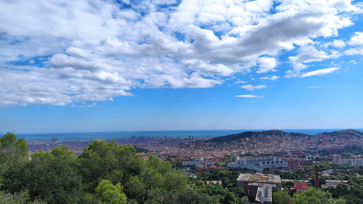 Clear sky over Barcelona with panoramic views of the Mediterranean coastline and cityscape