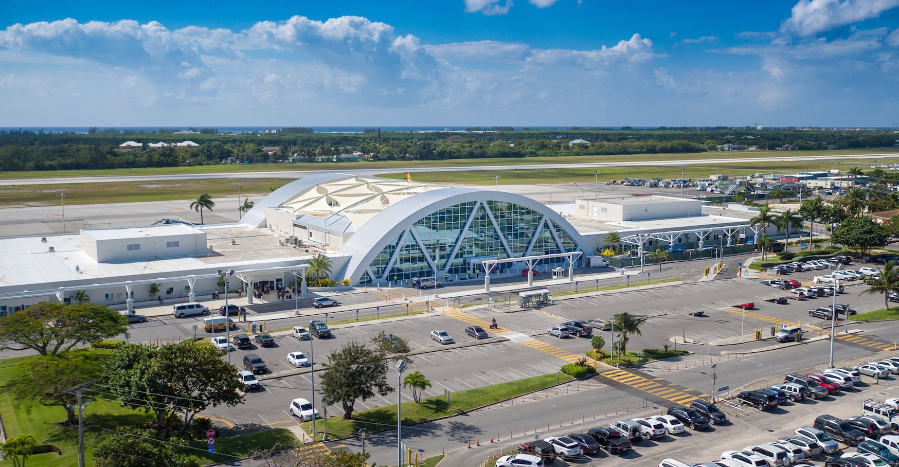 Owen Roberts International Airport exterior view with aircraft on the apron in Grand Cayman