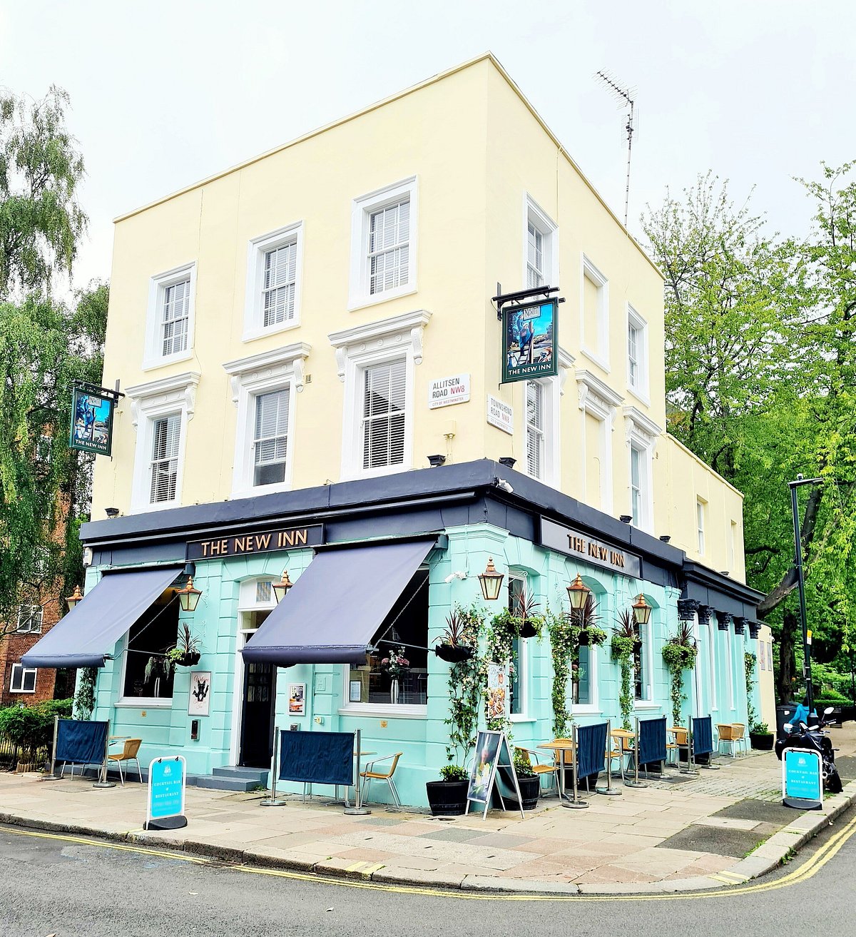 Boutique guesthouse-style building exterior in a calm neighborhood setting