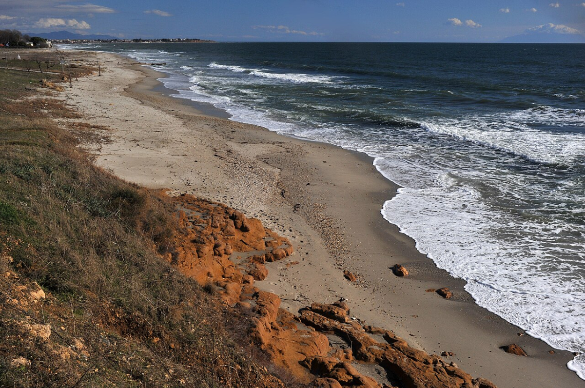 Sandy beach and waves along the coast of Fanari, Rhodope, Greece, photographed in 2010 Sandy beach and waves along the coast of Fanari, Rhodope, Greece, photographed in 2010