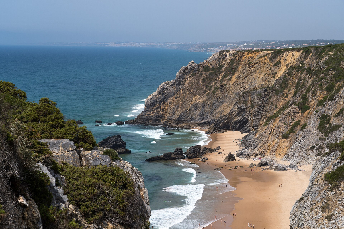 Cliffs and sandy cove at Praia da Adraga Cliffs and sandy cove at Praia da Adraga