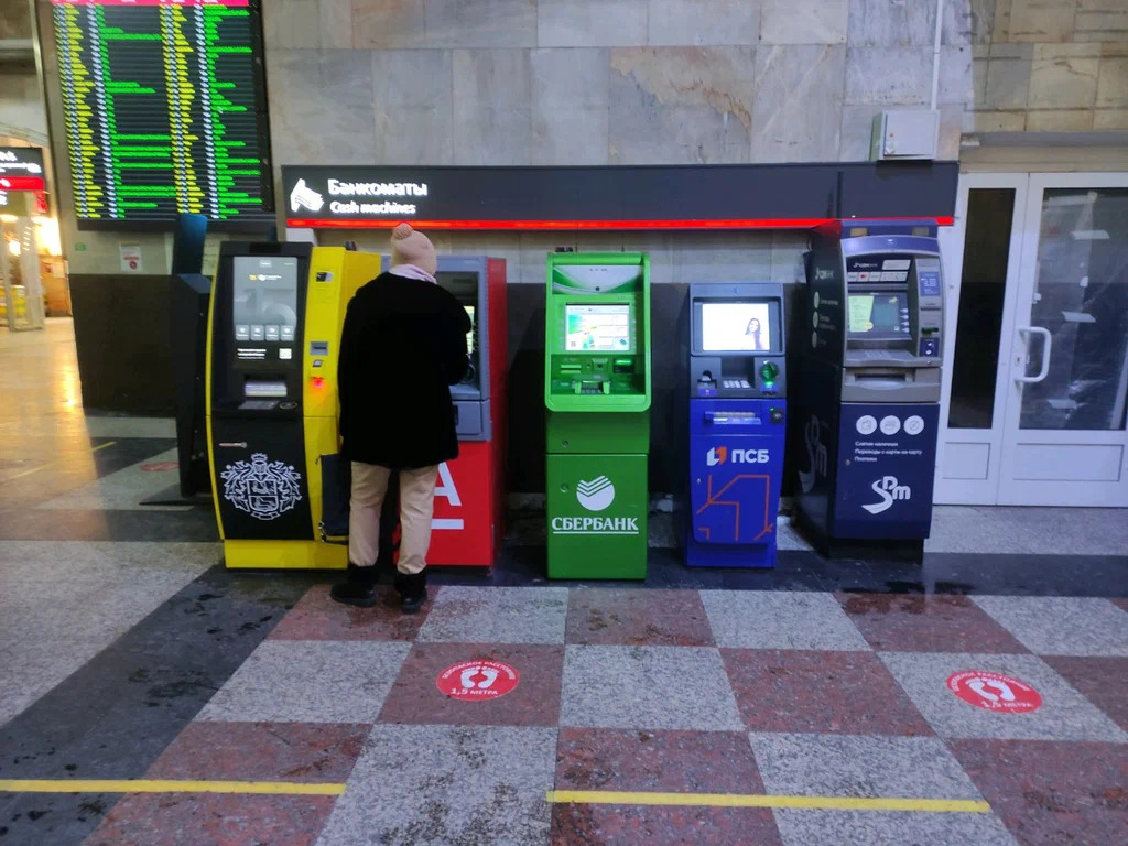 Traveler using an ATM in central Moscow