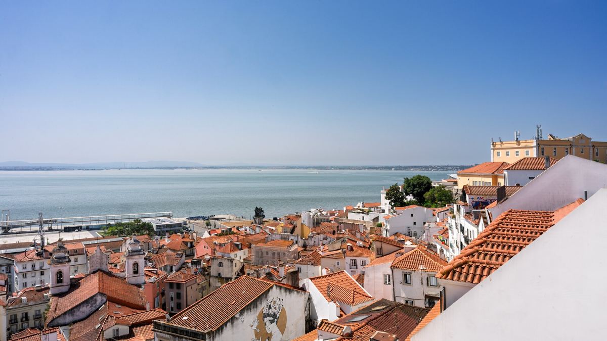 Alfama rooftops and the Tagus River in Lisbon Alfama rooftops and the Tagus River in Lisbon