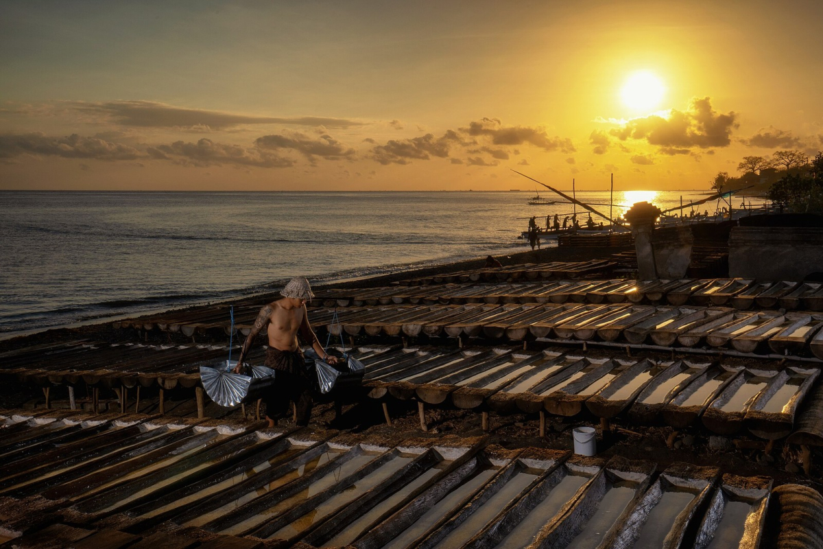 A traditional salt maker working beside the coast at Amed