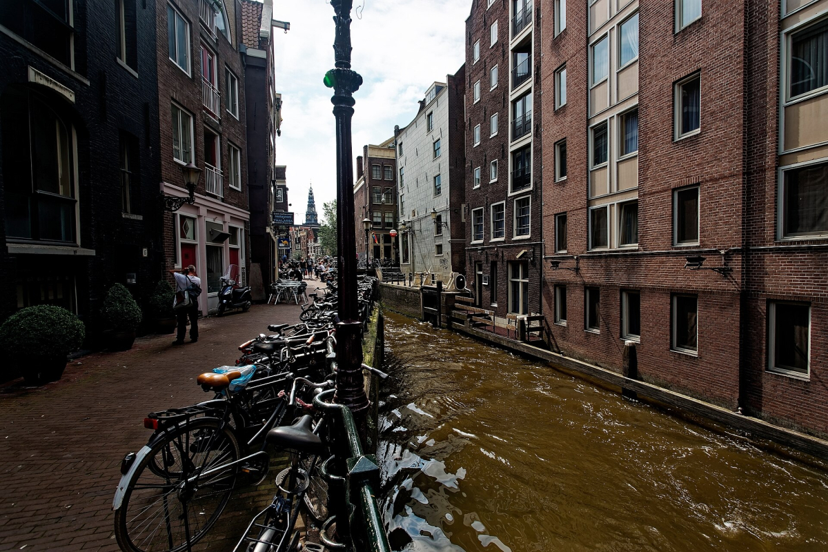 The Oude Kerk tower above the surrounding canal streets.