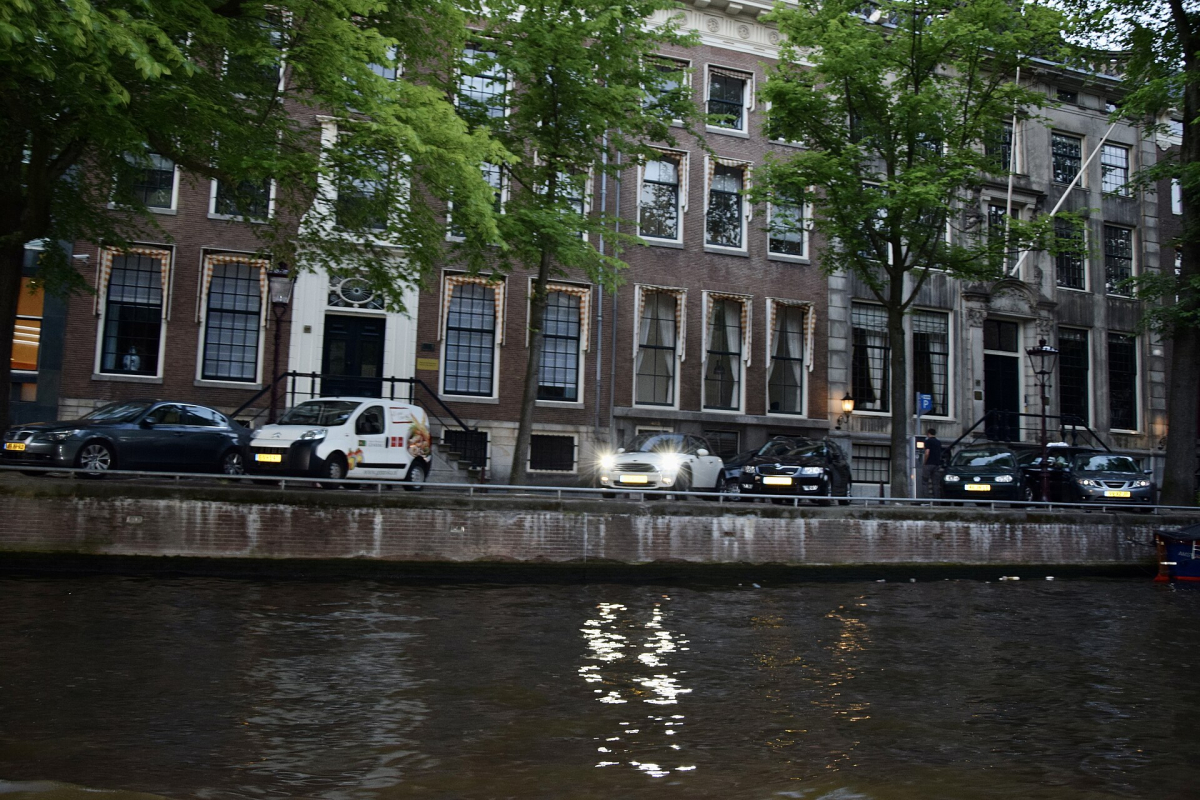 Amsterdam canal houses and the quay. Amsterdam canal houses and the quay.