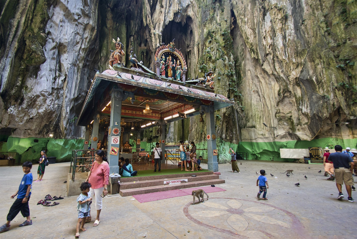 Shrines inside the main cave at Batu Caves. This active religious setting is reached by a substantial stairway. Shrines inside the main cave at Batu Caves. This active religious setting is reached by a substantial stairway.
