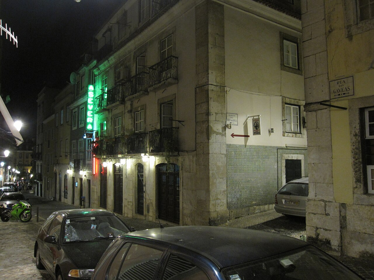 Bairro Alto at night Illuminated façades and cobbled street in Bairro Alto at night