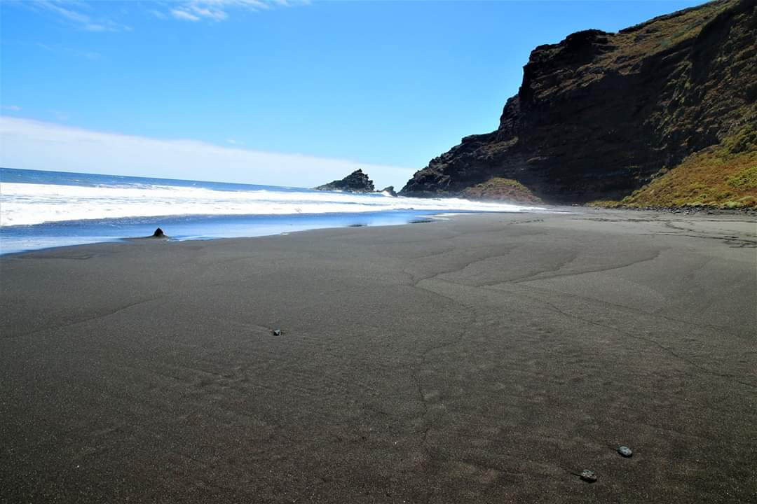 Black sand beach of Playa de Nogales surrounded by cliffs in La Palma