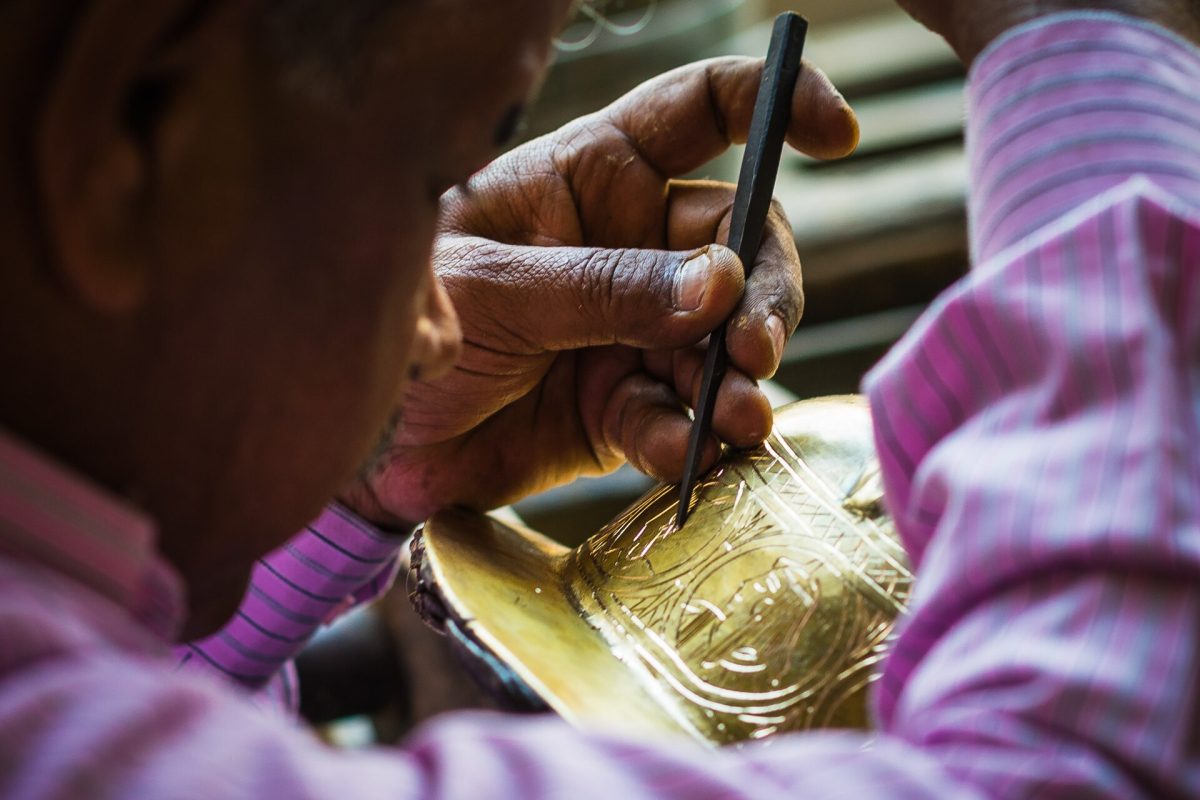 Craftsperson engraving a metal object in Cairo Craftsperson engraving a metal object in Cairo