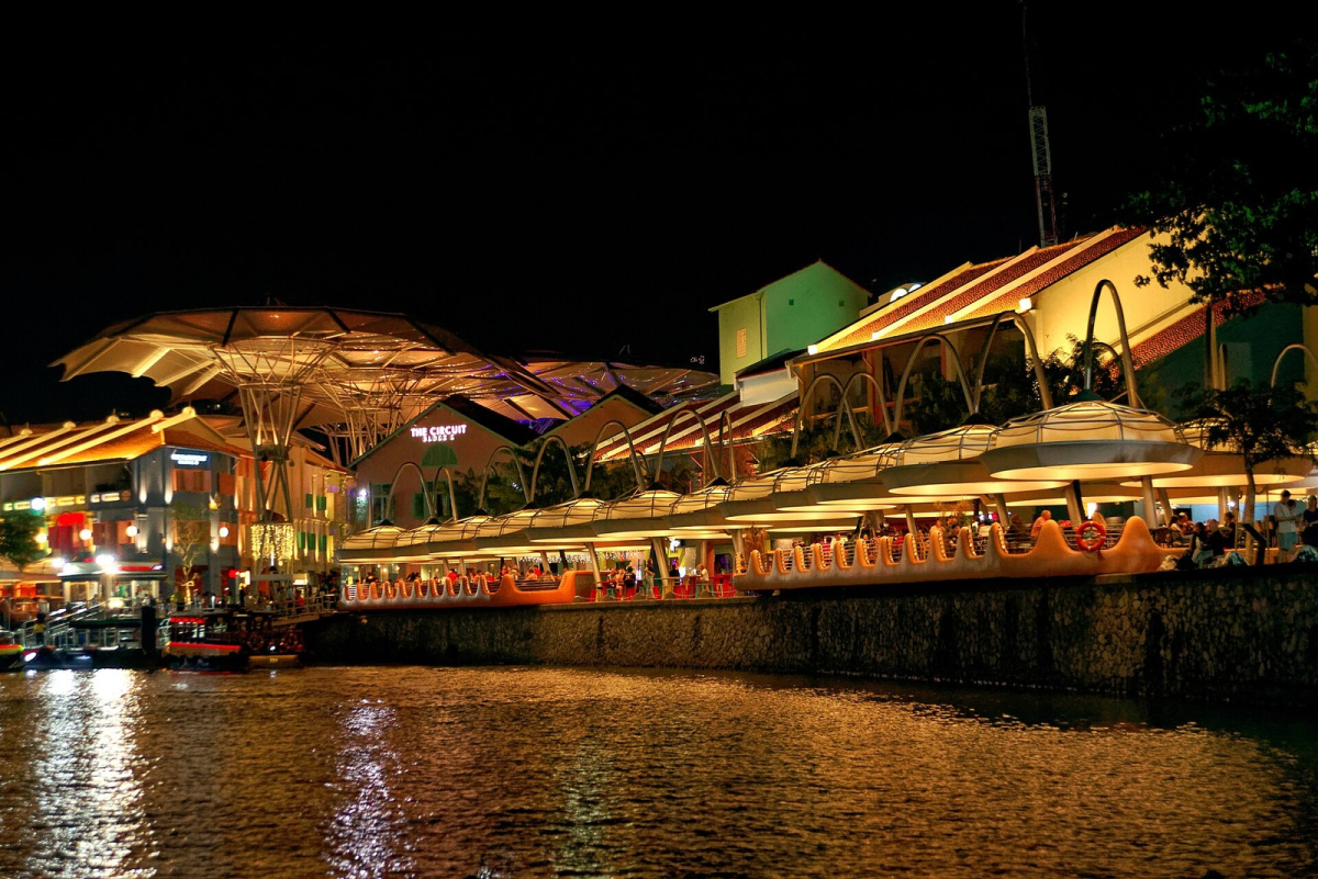 Clarke Quay at night in February 2024. Historical evening view; venues and operating arrangements may change. Clarke Quay at night in February 2024