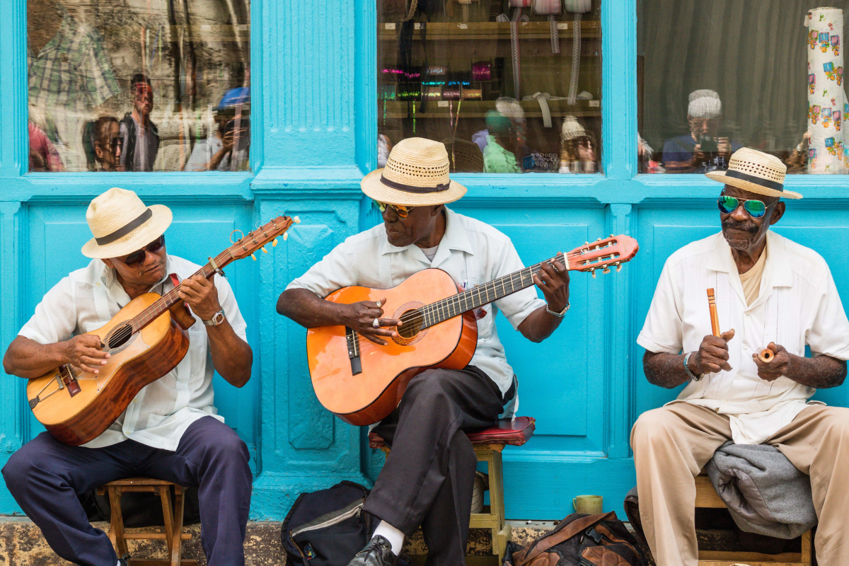 Cuban musicians performing with guitars  in Havana street