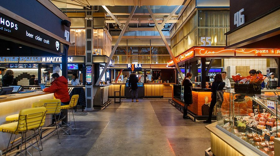 Food stalls and people dining inside Depo Moscow