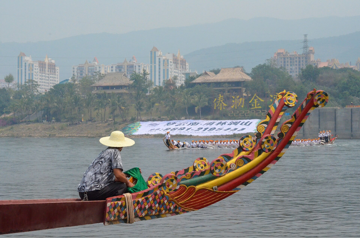 Dragon boat crews racing on water in China Dragon boat crews racing on water in China
