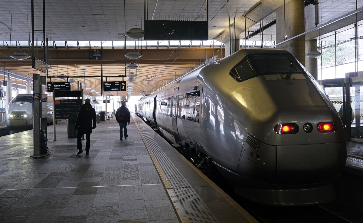 A Flytoget airport train at Gardermoen; check current ticket conditions separately. A Flytoget airport train at Gardermoen; check current ticket conditions separately.