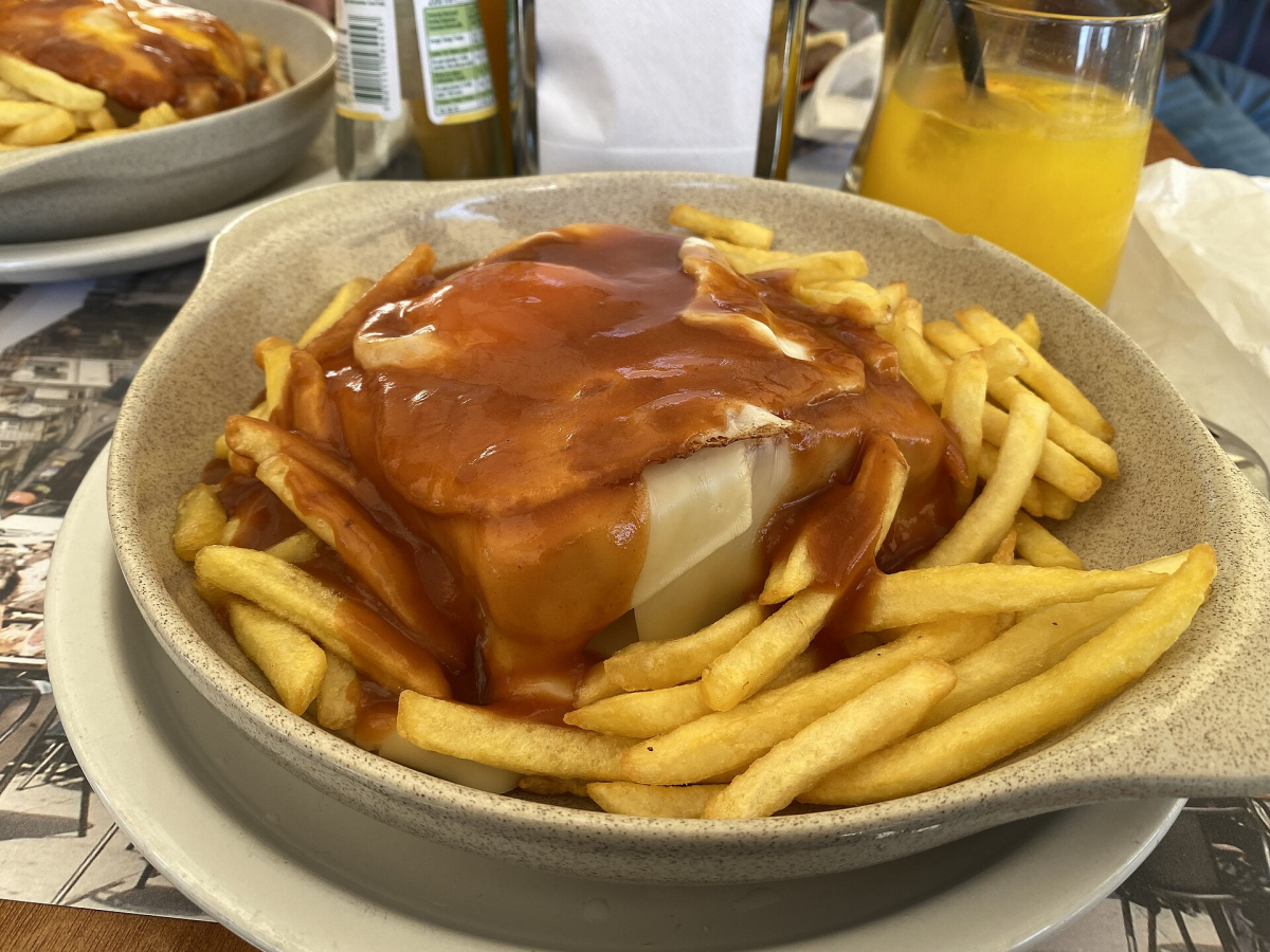 Francesinha with fries served in Porto