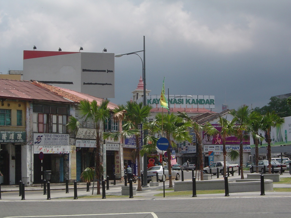 Street and shophouse setting in George Town, Penang.