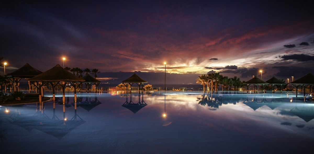Pool at Gran Meliá Palacio de Isora at dusk
