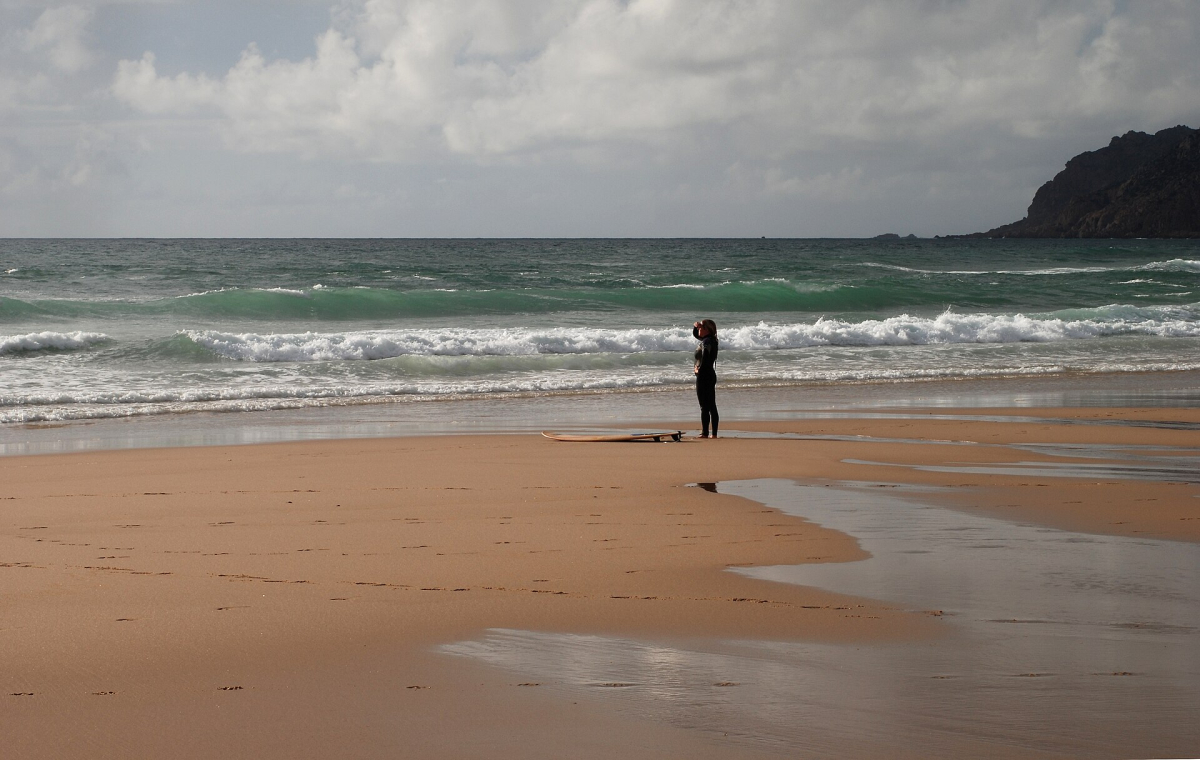 A visitor and Atlantic surf at Guincho A visitor and Atlantic surf at Guincho