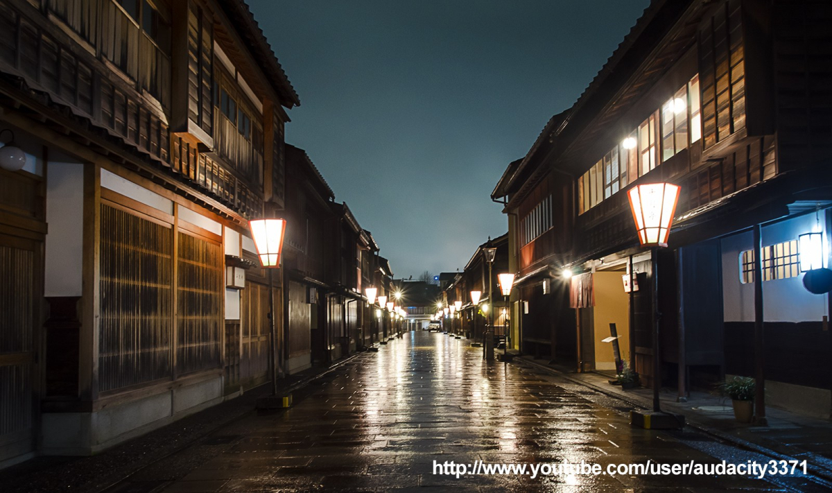A traditional Japanese street with buildings and shopfronts