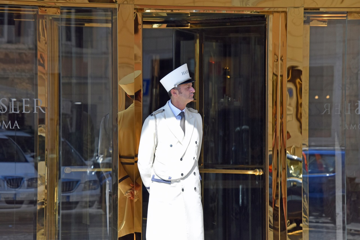 Hassler Roma entrance with a uniformed doorman Hassler Roma entrance with a uniformed doorman