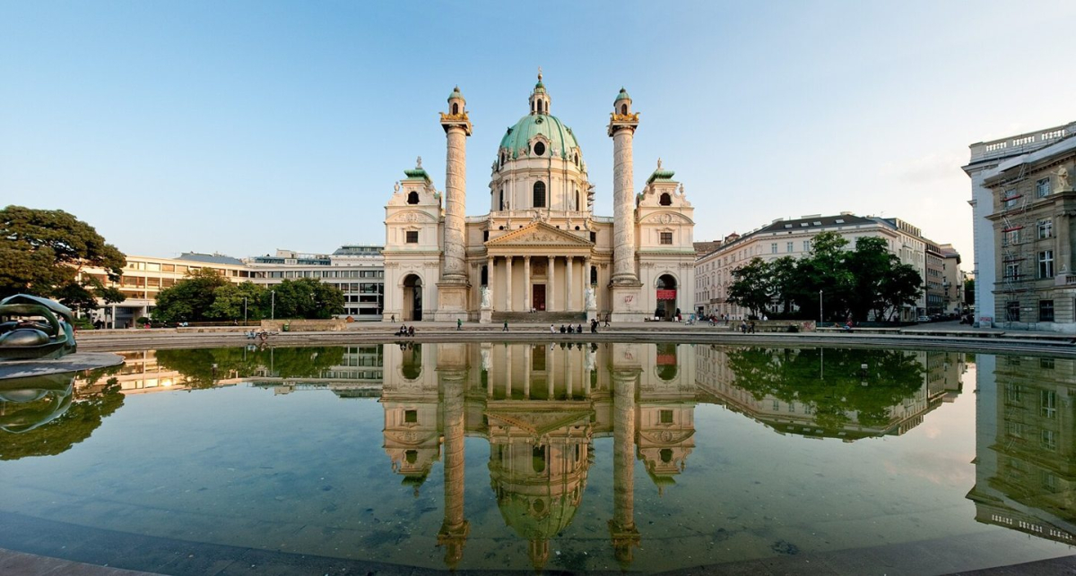 Karlskirche and its reflection in the foreground pool