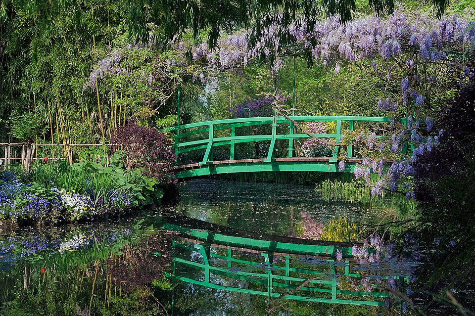 The Japanese bridge reflected in the water garden at Giverny. The Japanese bridge reflected in the water garden at Giverny.