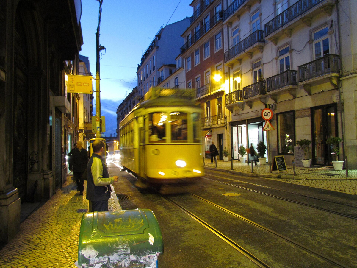 Historic tram on a Lisbon street after dark Historic tram on a Lisbon street after dark
