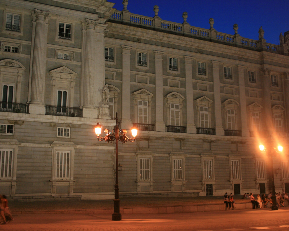 A detail of the Royal Palace façade at dusk.