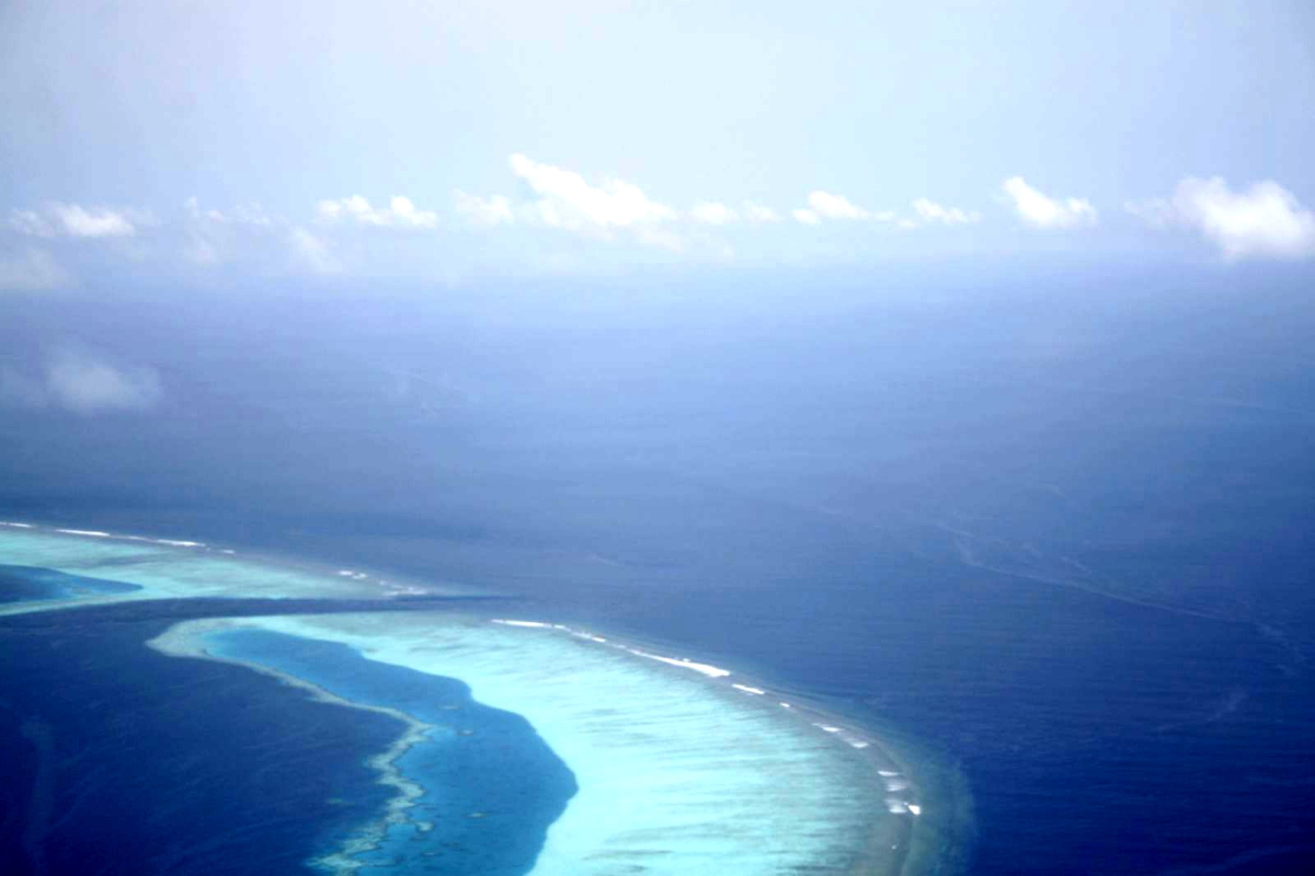 Island and reef seen from an air taxi in the Maldives Island and reef seen from an air taxi in the Maldives