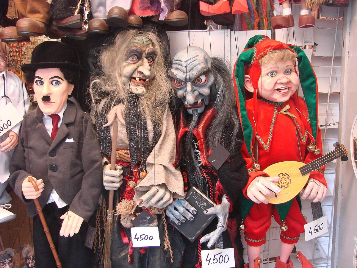 Character marionettes displayed for sale in a Prague shop