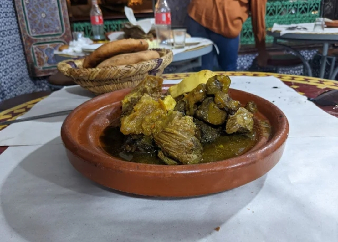 A Moroccan tagine served in an earthenware dish A Moroccan tagine served in an earthenware dish
