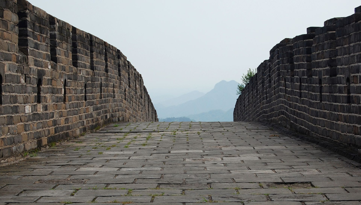 Stone walkway and brick parapets of the Great Wall near Beijing