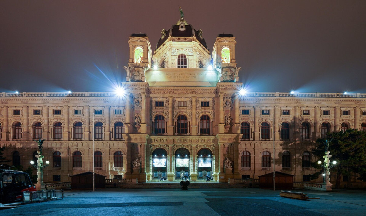 The illuminated Natural History Museum façade in Vienna