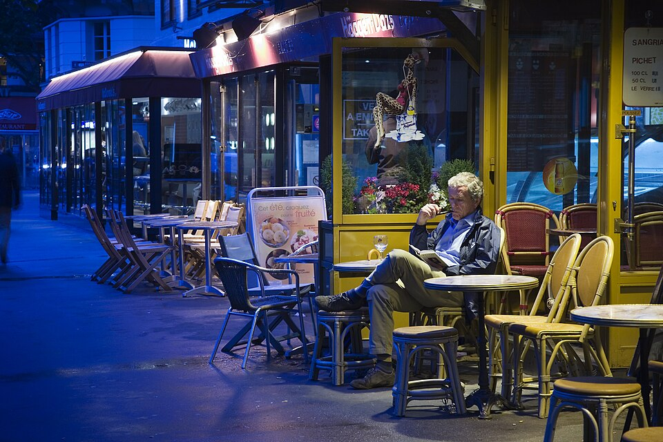 An evening café scene on Boulevard Saint-Germain.