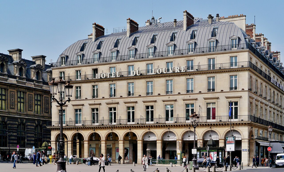 Hôtel du Louvre in its historic Paris streetscape; an exterior reference view, not a current room photograph.