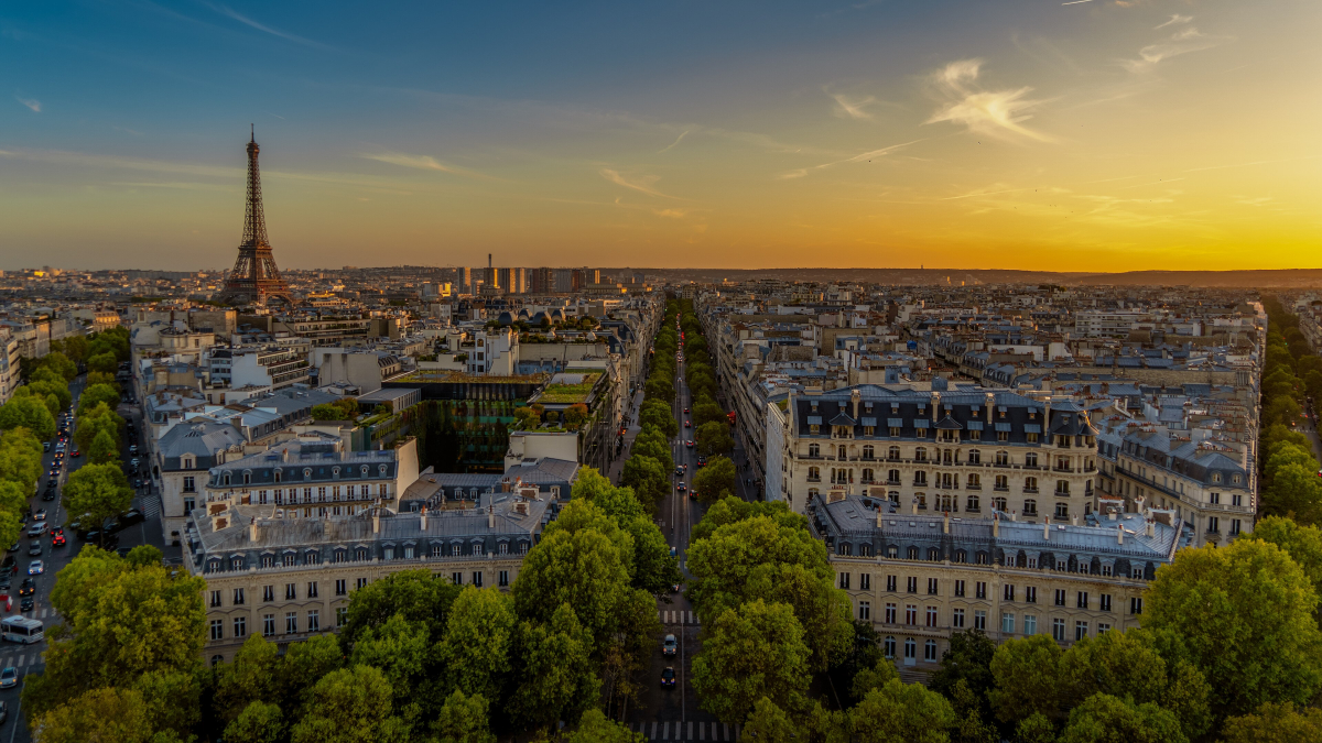 Paris skyline and the Eiffel Tower at sunset, viewed from the Arc de Triomphe.