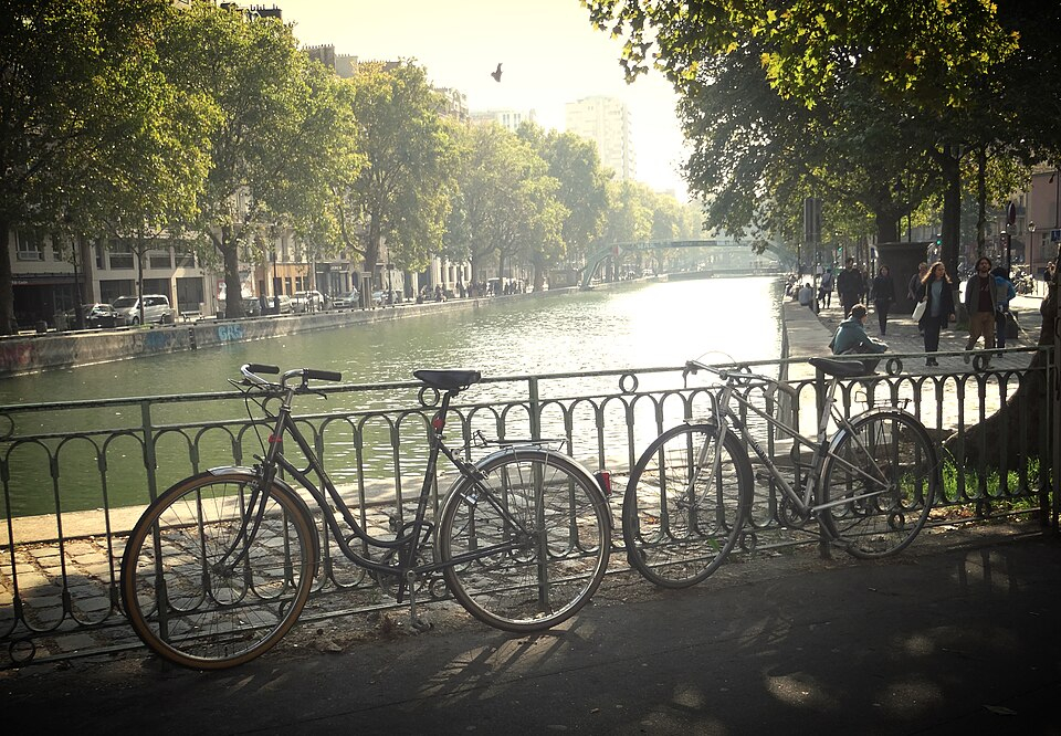 Bicycles beside Canal Saint-Martin in afternoon light; use designated cycle routes and respect pedestrians. Bicycles beside Canal Saint-Martin in afternoon light; use designated cycle routes and respect pedestrians.