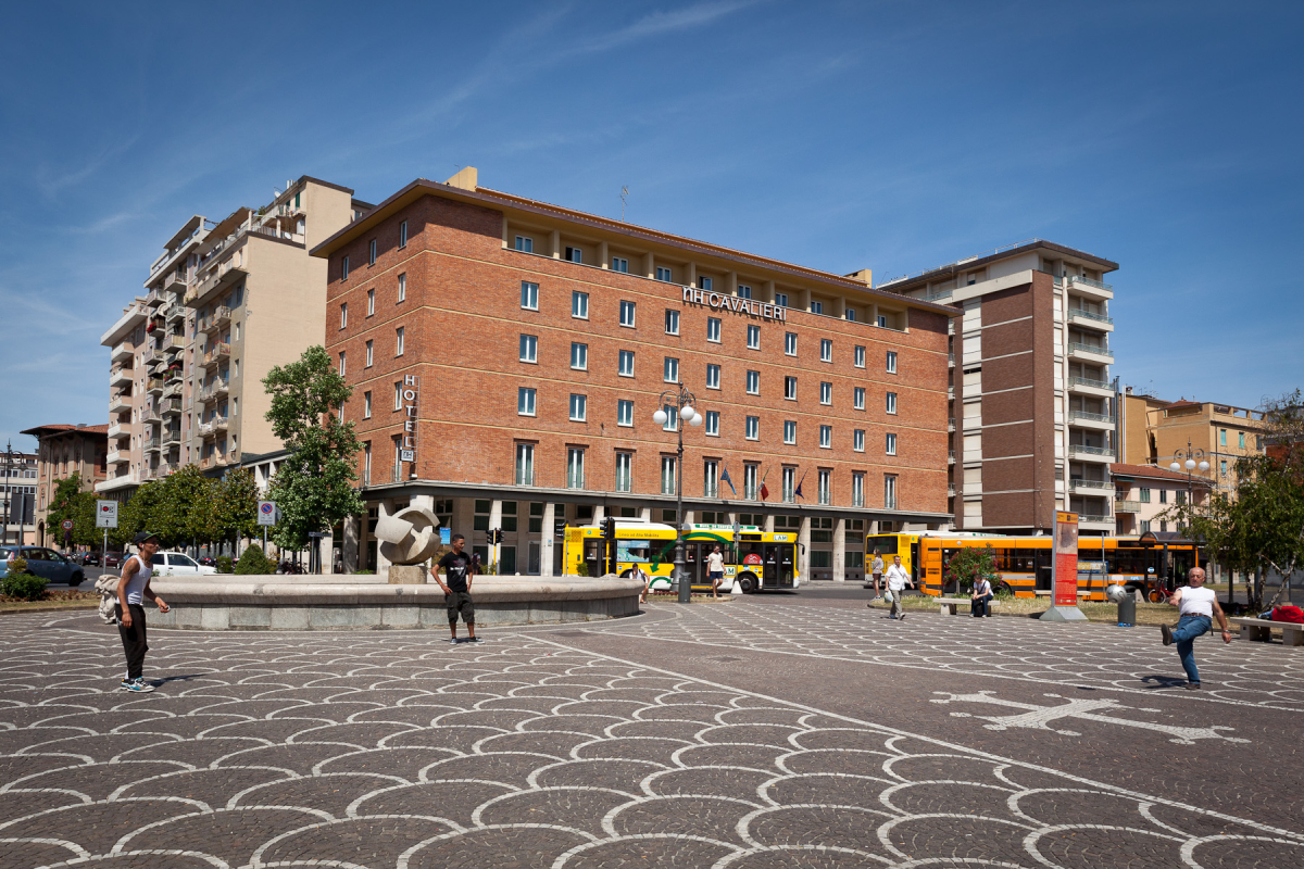 The hotel building on Piazza della Stazione, historically labelled Cavalieri and now NH Pisa.