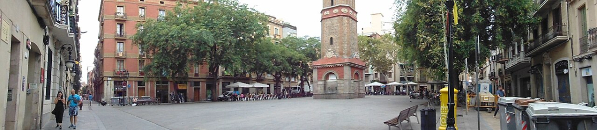 Panoramic view of Plaça de la Vila de Gràcia and its clock tower