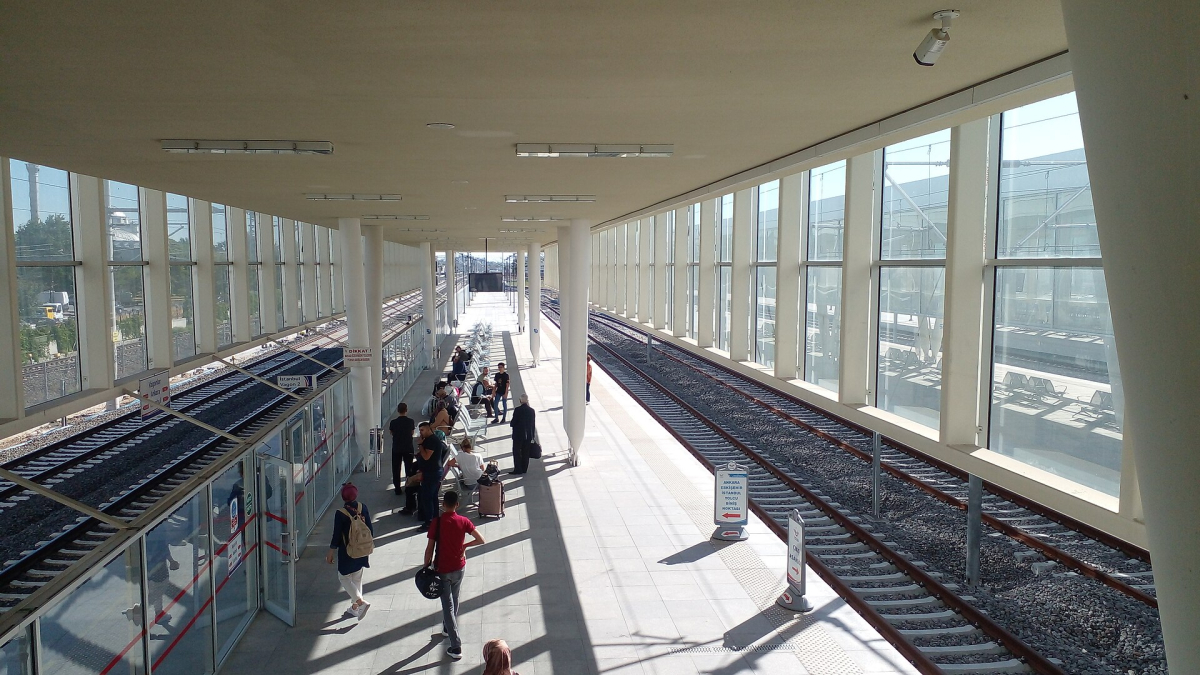 Passengers waiting beside the tracks at Selçuklu high-speed railway station